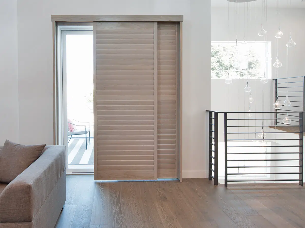 a sliding door fitted with Norman Bypass Shutters