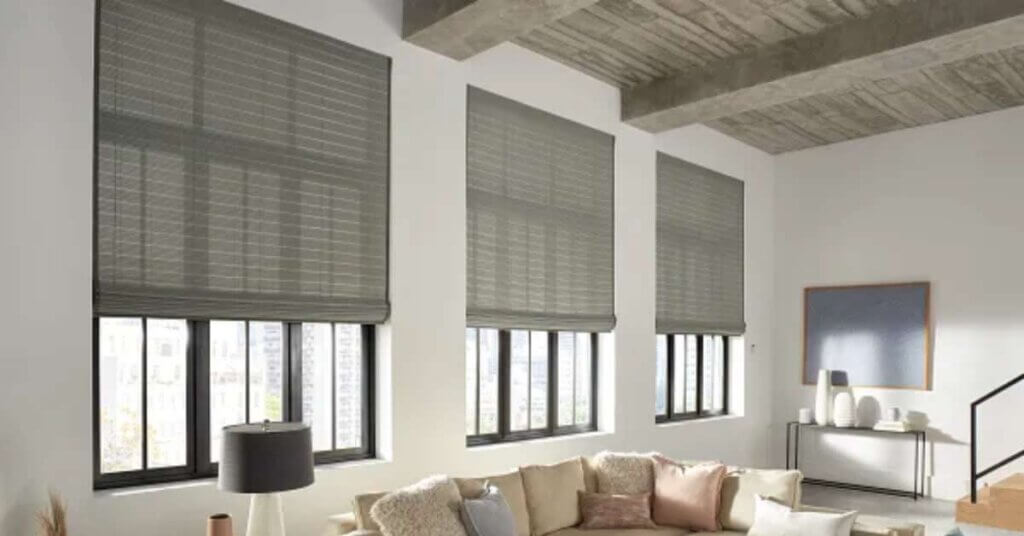 Graber Motorized Roman Shades in Tall Living Room Windows