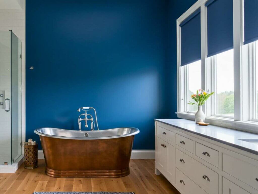 Roller shades are a popular choice for modern bathrooms due to their clean lines and moisture-resistant fabrics.